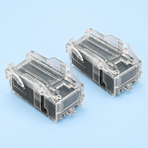 Two Canon Staple Cartridge X1 units side by side showing clear plastic housing and staple stack