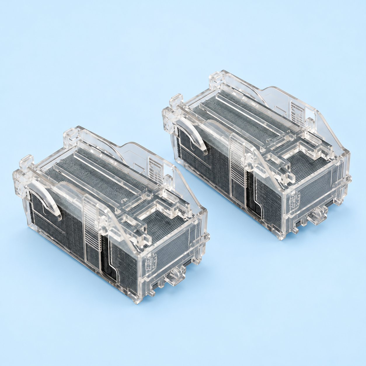 Canon Staple Cartridge X1 – Dual Cartridge Pair View Two Canon Staple Cartridge X1 units side by side showing clear plastic housing and staple stack